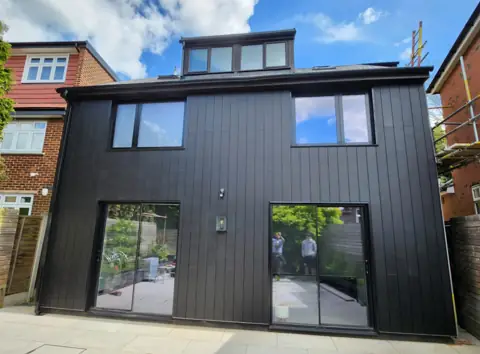 Vertical cladding on a two-storey extension — CG Cladding Solutions